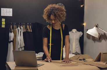 Image showing Fashion designer on her Atelier