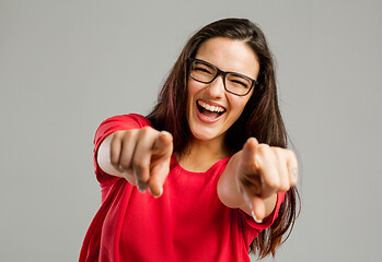 Image showing Happy woman pointing to the camera