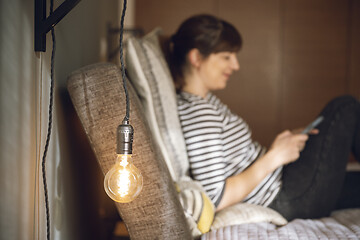 Image showing Woman sending a text message