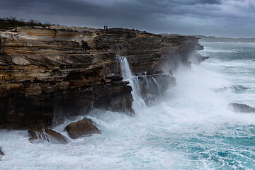 Image showing Large swells batter the cliffs of Sydney