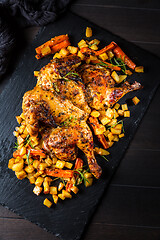 Image showing Butterflied grilled whole chicken with roasted vegetables and potatoes 
