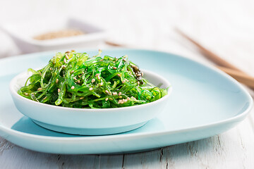 Image showing Traditional Japanese wakame salad with sesam seeds. Healthy seaweed salad.