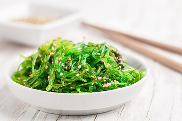 Image showing Traditional Japanese wakame salad with sesam seeds. Healthy seaweed salad.