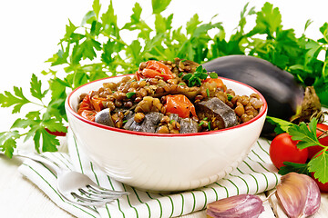 Image showing Lentils with eggplant in bowl on light board