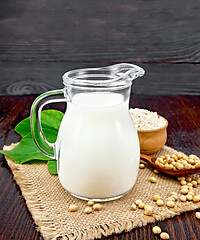 Image showing Milk soy in jug with flour on board