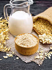 Image showing Flour oat in bowl on wooden board