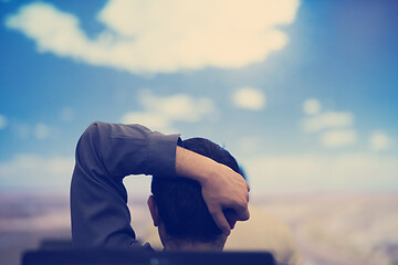 Image showing young man dreaming clouds on presentation