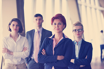 Image showing diverse business people group with redhair  woman in front