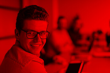 Image showing Businessman using tablet in modern office