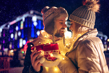 Image showing Adult couple hanging out in the city during Christmas time