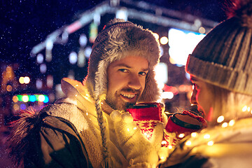 Image showing Adult couple hanging out in the city during Christmas time