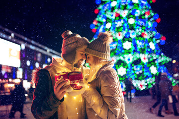 Image showing Adult couple hanging out in the city during Christmas time