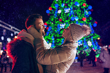 Image showing Adult couple hanging out in the city during Christmas time