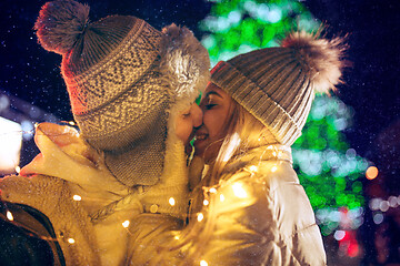 Image showing Adult couple hanging out in the city during Christmas time