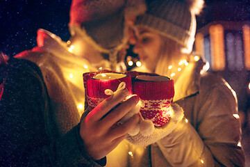 Image showing Adult couple hanging out in the city during Christmas time