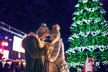 Image showing Adult couple hanging out in the city during Christmas time