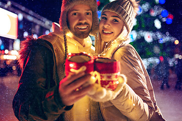 Image showing Adult couple hanging out in the city during Christmas time