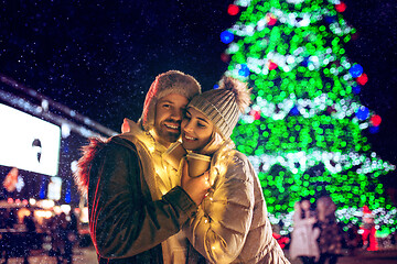 Image showing Adult couple hanging out in the city during Christmas time