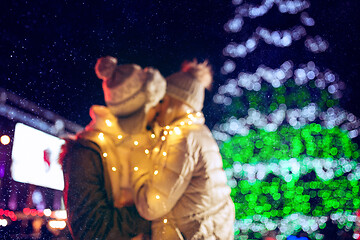 Image showing Adult couple hanging out in the city during Christmas time