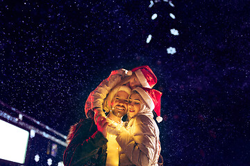 Image showing Adult couple hanging out in the city during Christmas time