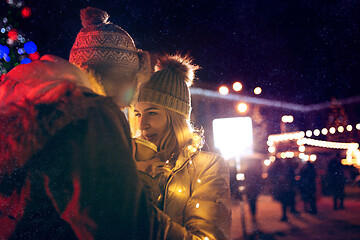 Image showing Adult couple hanging out in the city during Christmas time