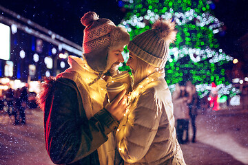 Image showing Adult couple hanging out in the city during Christmas time