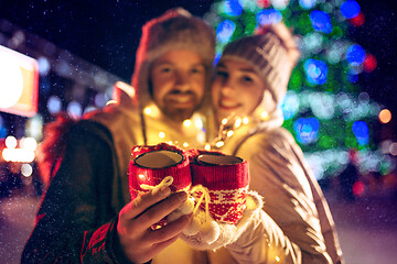 Image showing Adult couple hanging out in the city during Christmas time