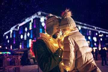 Image showing Adult couple hanging out in the city during Christmas time