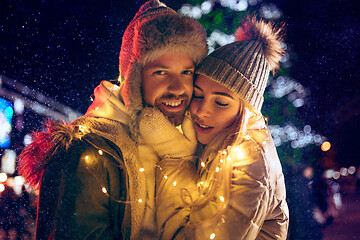 Image showing Adult couple hanging out in the city during Christmas time