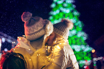 Image showing Adult couple hanging out in the city during Christmas time