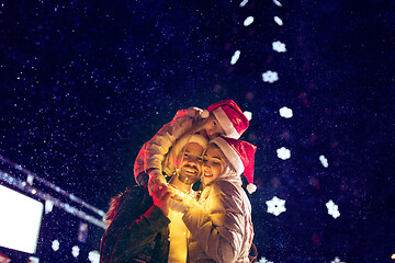 Image showing Adult couple hanging out in the city during Christmas time