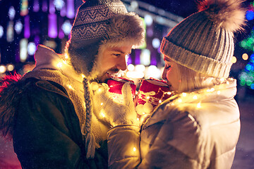 Image showing Adult couple hanging out in the city during Christmas time