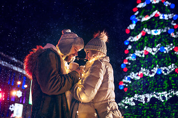 Image showing Adult couple hanging out in the city during Christmas time