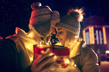 Image showing Adult couple hanging out in the city during Christmas time