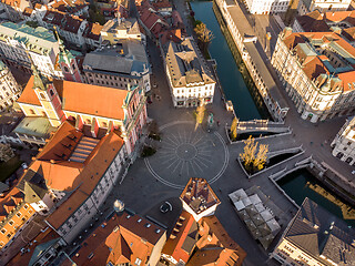 Image showing Aerial drone view of Preseren Squere and Triple Bridge over Ljubljanica river,Tromostovje, Ljubljana, Slovenia. Empty streets during corona virus pandemic social distancing measures