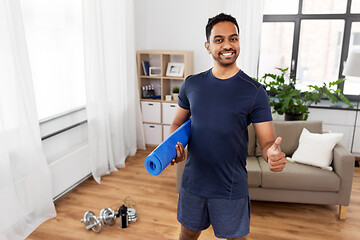 Image showing indian man with fitness tracker showing thumbs up