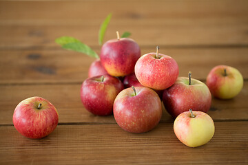 Image showing ripe red apples on wooden table