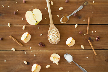 Image showing apples, oatmeal, cinnamon, nuts and sugar