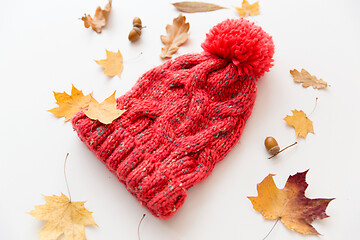 Image showing hat and fallen autumn leaves on white background