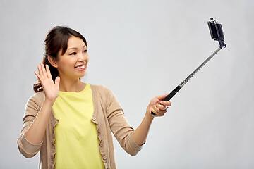 Image showing asian woman taking selfie by smartphone