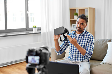 Image showing male blogger with vr glasses videoblogging at home