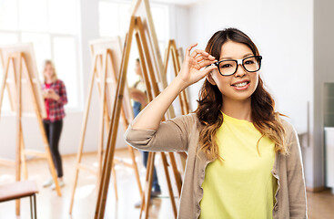 Image showing happy asian woman in glasses or student