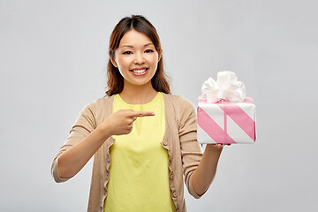 Image showing african american woman showing birthday gift