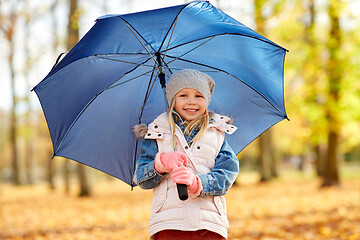 Image showing happy little girl with umbrella at autumn park