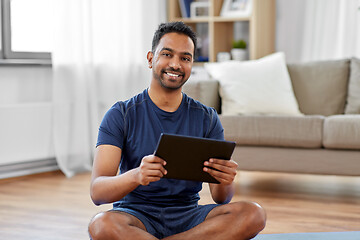 Image showing indian man with tablet pc and exercise mat at home