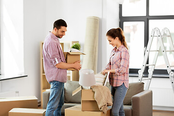 Image showing happy couple with stuff moving to new home