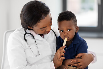 Image showing doctor or pediatrician with baby patient at clinic