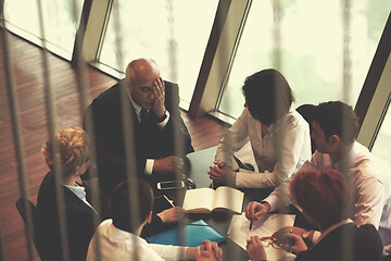 Image showing business people group on meeting at modern bright office