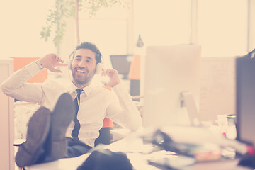 Image showing relaxed young business man at office