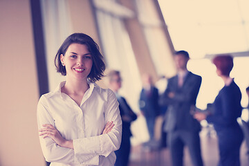 Image showing business people group, woman in front  as team leader